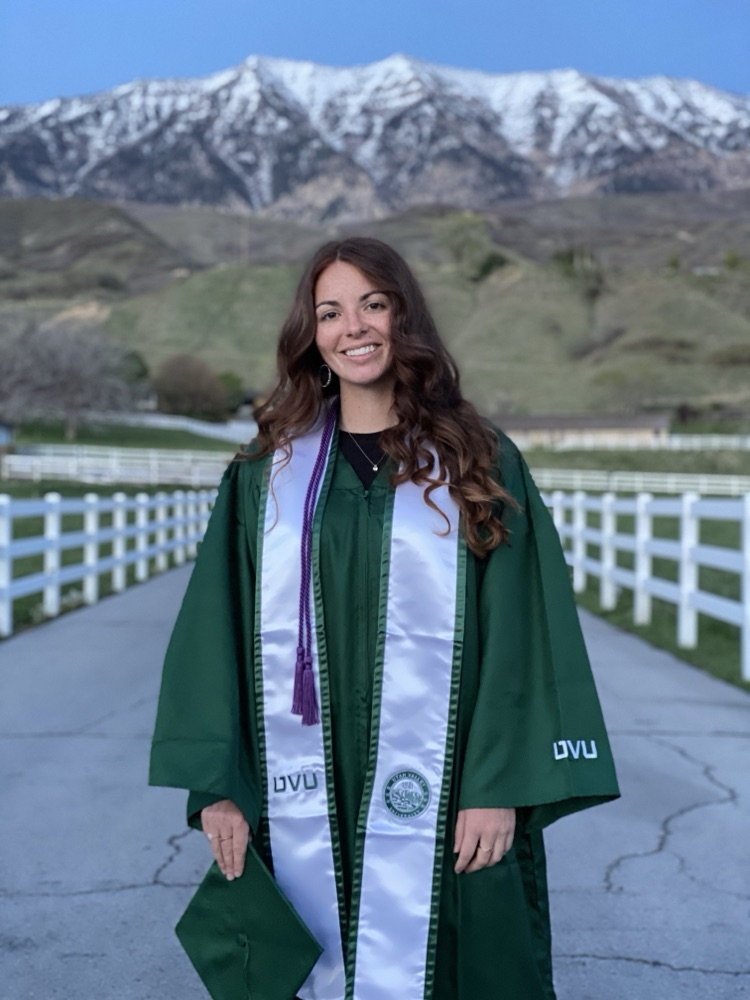 Hailey Johnson at her university graduation in cap and gown