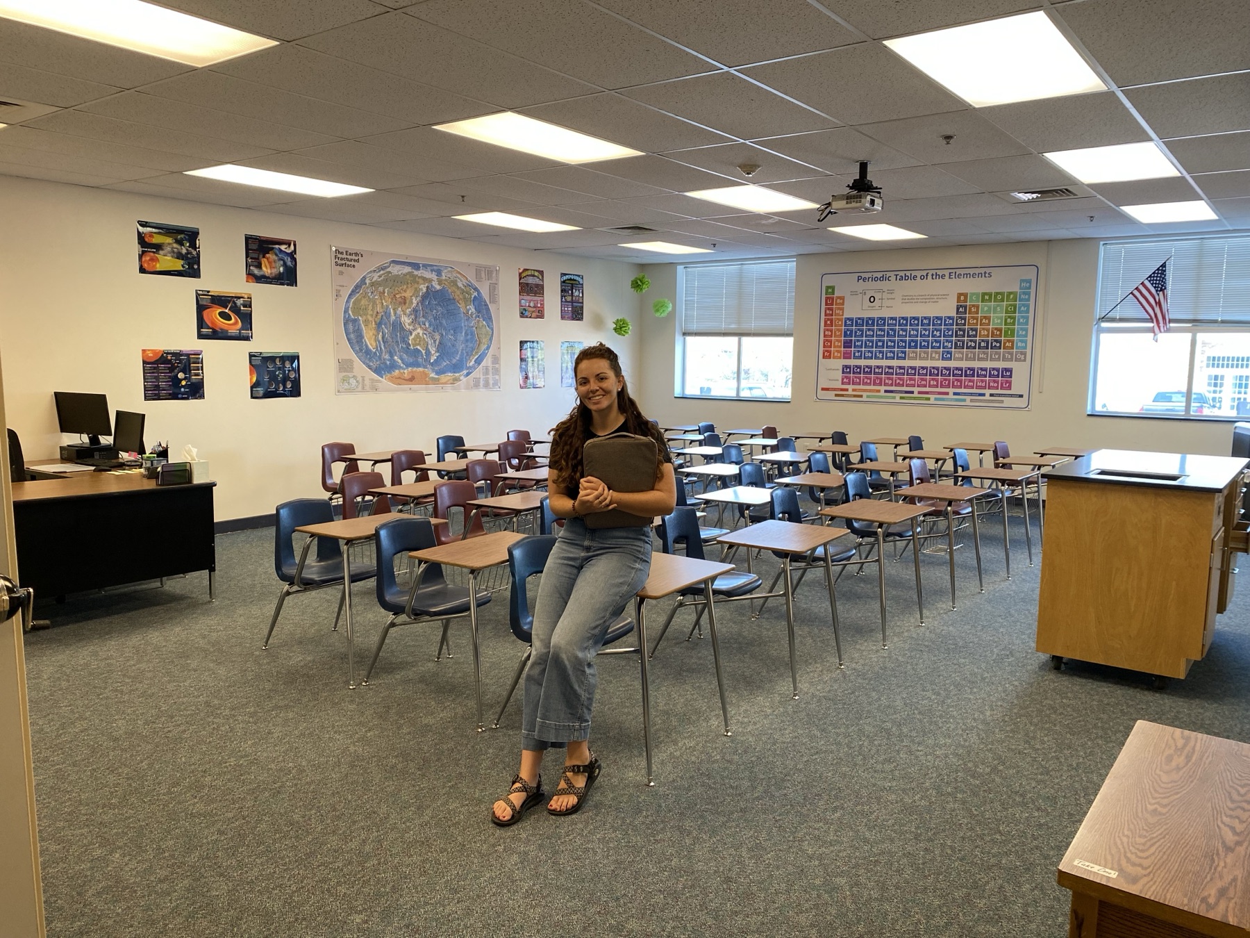 Hailey Johnson standing in her middle school science classroom